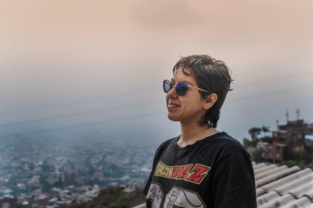 Young woman wearing shades and smiling